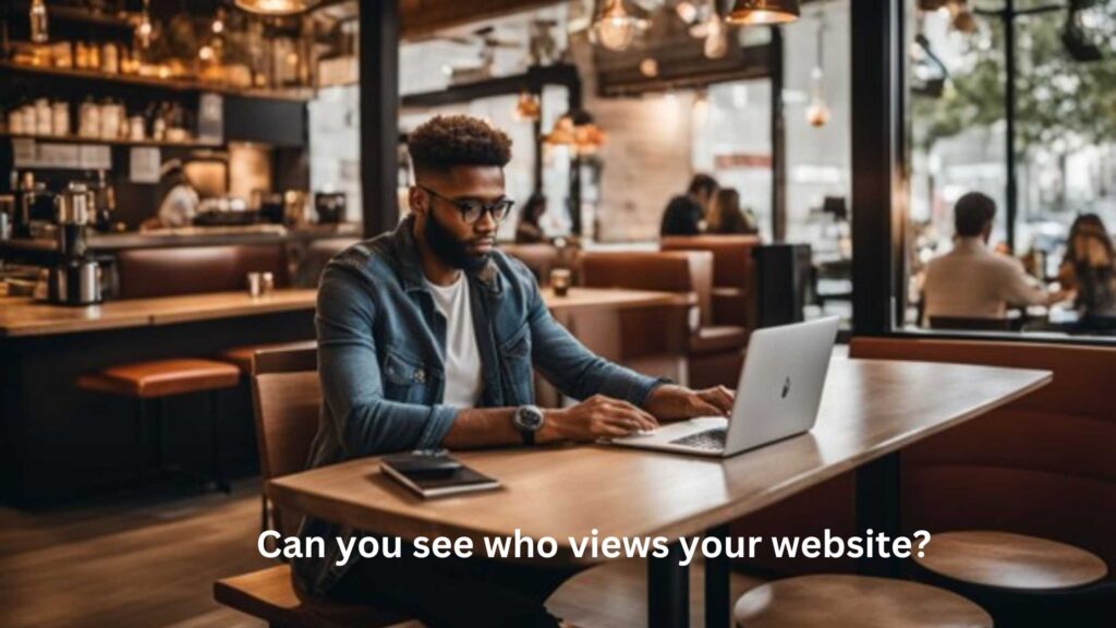 a man is working on the laptop of restaurant table